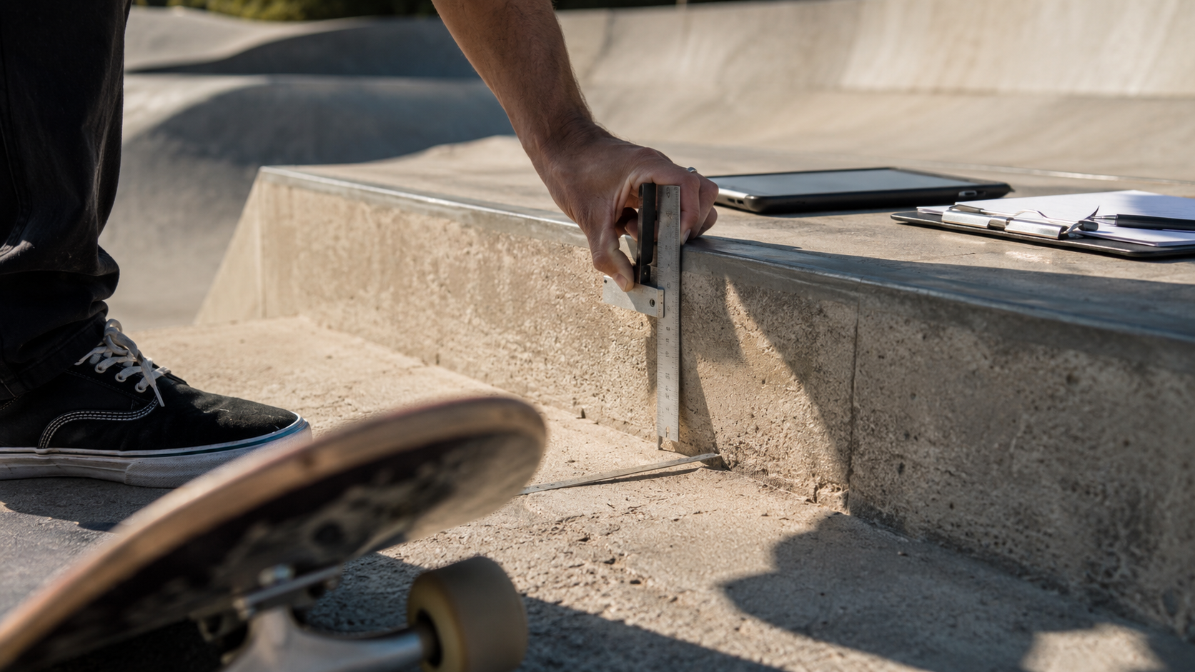 Auditor measuring skatepark ledge dimensions against AS EN 14974:2021